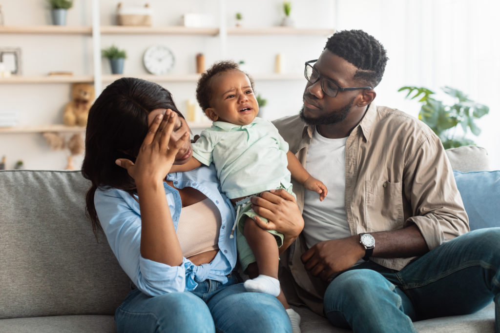 Family with mother head in hands